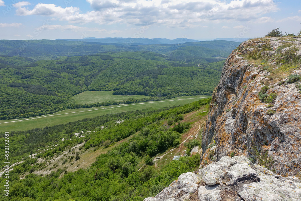 Fototapeta premium Mangup-Kale cave city, sunny day. Mountain view from the ancient cave town of Mangup-Kale in the Republic of Crimea, Russia. Bakhchisarai.