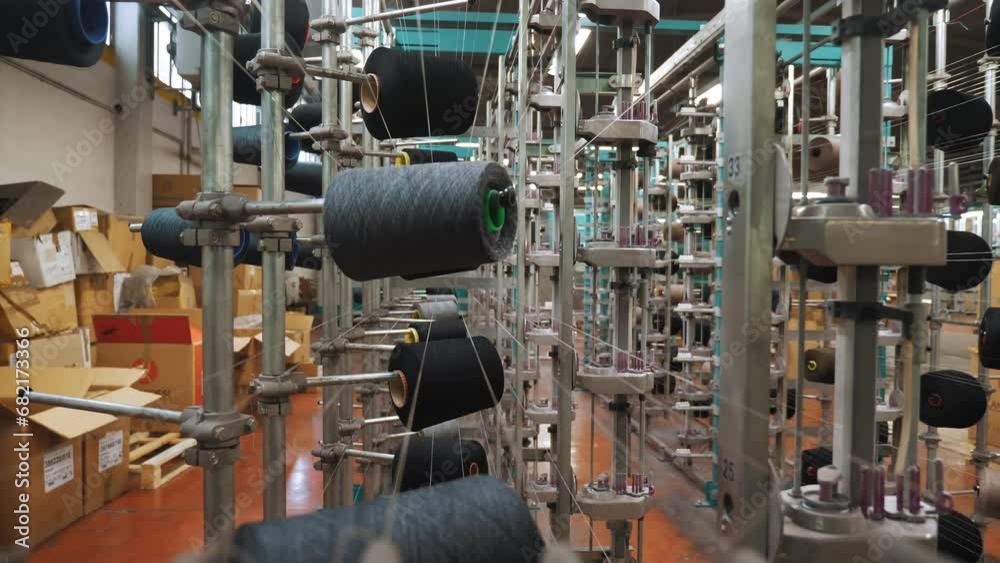 thread spools. textile industry. weaving factory. racks with many thread spools. dyeing and drying of threads for further fabric production. automated work process. textile manufacture. thread spools. textile industry. weaving factory. racks with many thread spools. dyeing and drying of threads for further fabric production. automated work process. textile manufacture.