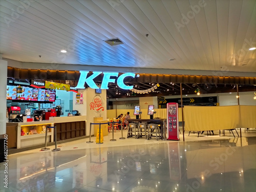 KFC (Kentucky Fried Chicken) is an American fast food restaurant chain that specializes in fried chicken. KFC restaurant building in Ahmad Yani Airport. 