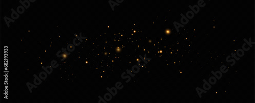 Golden sequins glow with many lights. Glittering dust. Luxurious background of golden particles.	