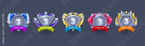 Game level up and win metal badges. Arcade level up prize, gambling app victory realistic vector sign, gaming task complete, win rank or achievements rating realistic vector badge with silver medals photo