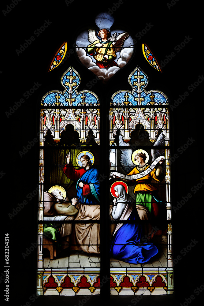 Stained glass window in St Germain church, Rugles, France.