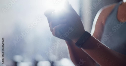 Woman, hands and powder at gym getting ready for workout, exercise or indoor training in weightlifting. Closeup of active female person, athlete or bodybuilder clapping chalk in preparation to lift photo