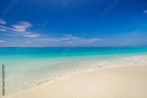 Nature landscape view of beautiful tropical beach and sea in sunny day. Beach waves inspire summer vacation. Nature of tropical Mediterranean beach sunlight. Light sand beach, ocean water sparkles