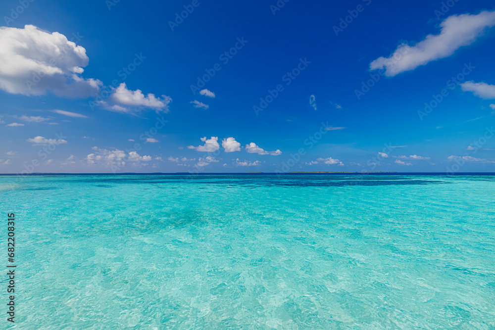 Naklejka premium Crystal clear sea water bay. Pristine ocean lagoon sunny cloudy sky, idyllic relaxing seascape. Transparent surface, exotic travel. tropics Mediterranean nature panorama. Summer background, beach view