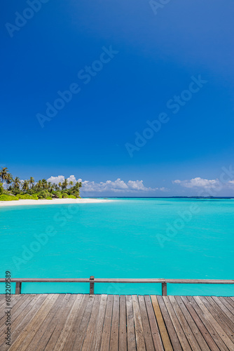 Summer beautiful landscape, nature of tropical beach with wooden platform, sunlight. White sand beach palm trees bright sea water and sunny blue sky. Copy space summer vacation destination concept
