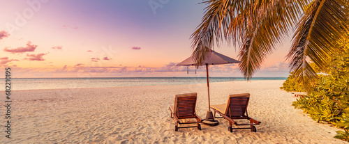 Romantic beach. Love couple chairs sandy beach sea sunset sky. Luxury summer holiday honeymoon vacation resort hotel tourism. Inspire tropical paradise. Tranquil honeymoon relax beach beauty landscape