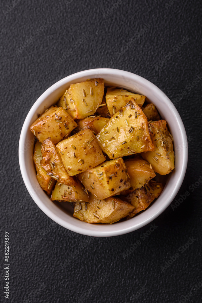 Delicious crispy fried potato wedges with salt, spices and herbs Delicious crispy fried potato wedges with salt, spices and herbs