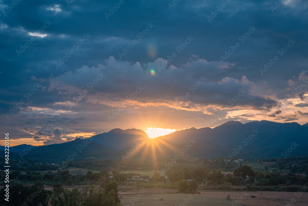 Scene of sunset on the rices field  in the summer with a cloudy sky background. Landscape.