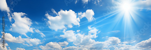 Heaven of blue sky, sun and clouds. Panoramic banner. Copy space where you can easily insert text such as advertisements. photo