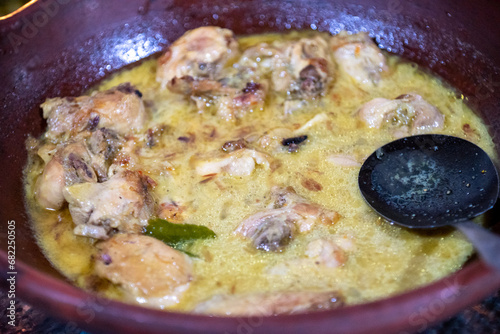 Opor ayam is an Indonesian dish from Central Java consisting of chicken cooked in coconut milk. The spice mixture includes galangal, lemongrass, cinnamon, tamarind juice, palm sugar, coriander, cumin
