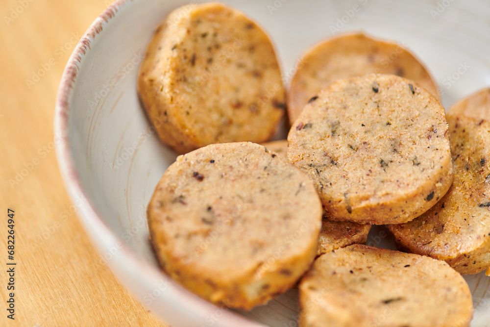 healthy vegetarian eating concept, close up view of bowl with delicious homemade vegetarian cutlets
