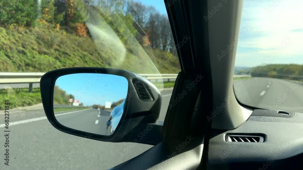 car rear mirror reflection of the highway car rear mirror reflection of the highway