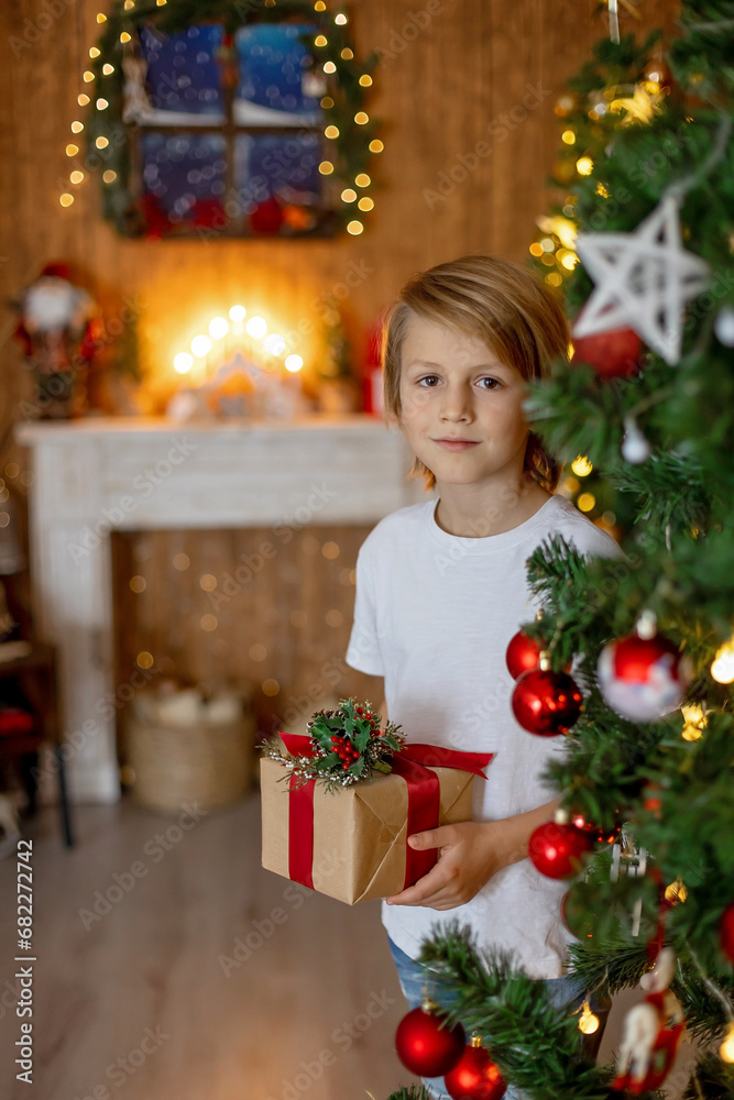 Preteen child, cute kid in studio for Christmas, xmas pictures with decorated cozy home,
