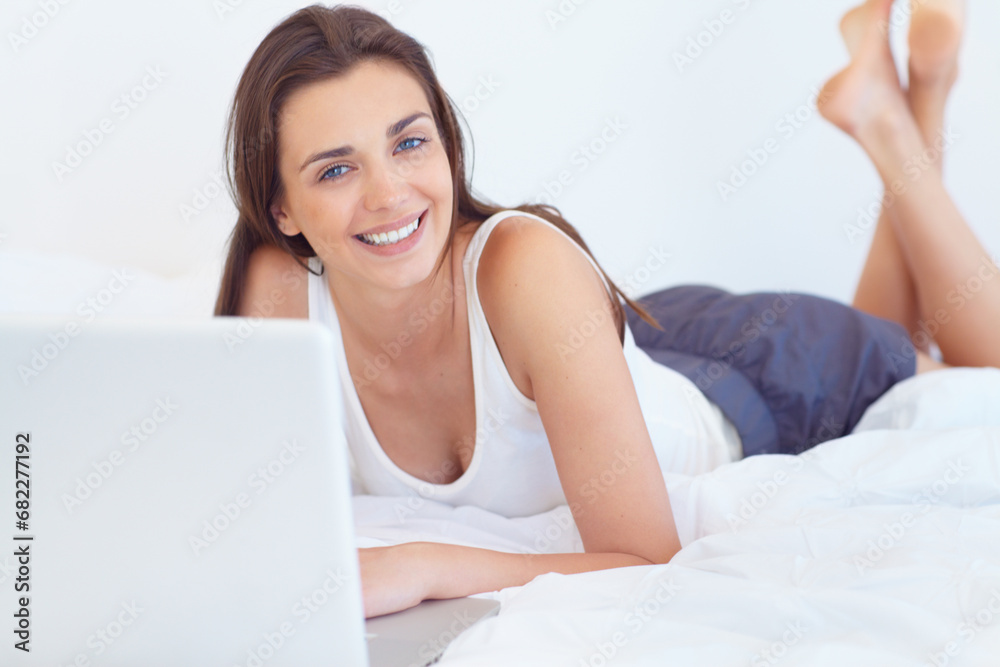 Laptop, bed and portrait of happy woman in morning checking email, schedule or social media post in home. Relax, rest and peace, happy girl with computer and online in apartment, house or bedroom.