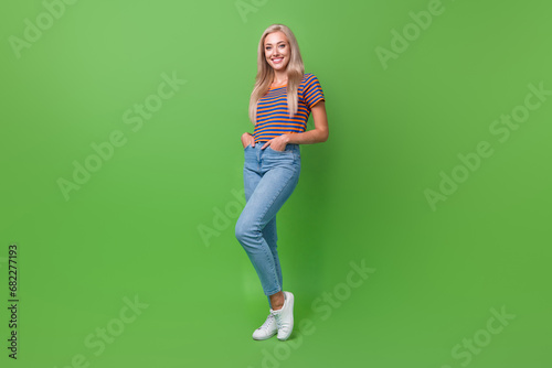 Fototapeta Naklejka Na Ścianę i Meble -  Full length size photo of charming young business analytic lady in casual clothing posing at office isolated on green color background