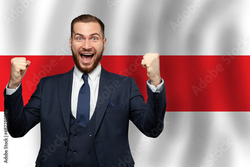 Belarussian happy businessman on the background of flag of Belarus Business, education, degree and citizenship concept photo