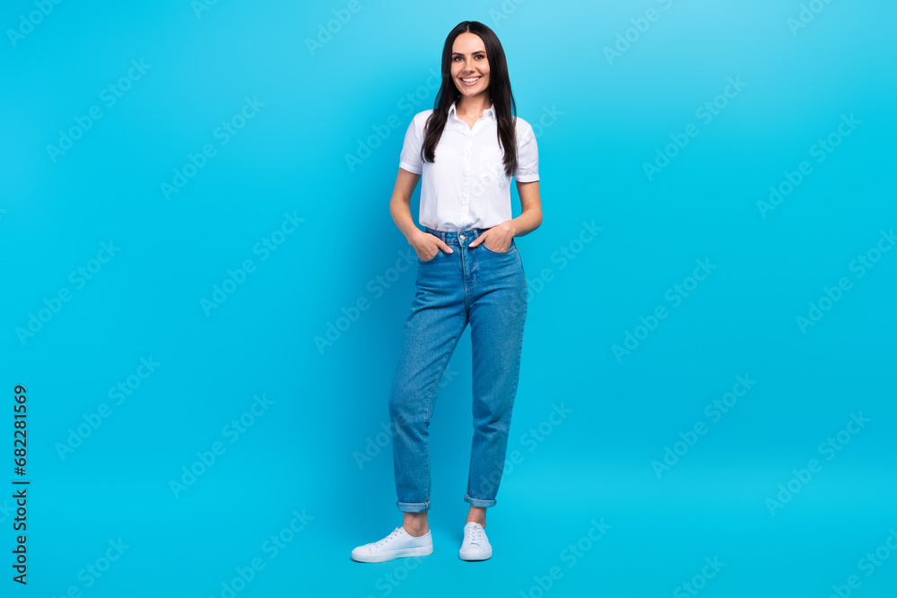 Full length photo of sweet shiny lady wear white shirt smiling walking isolated blue color background