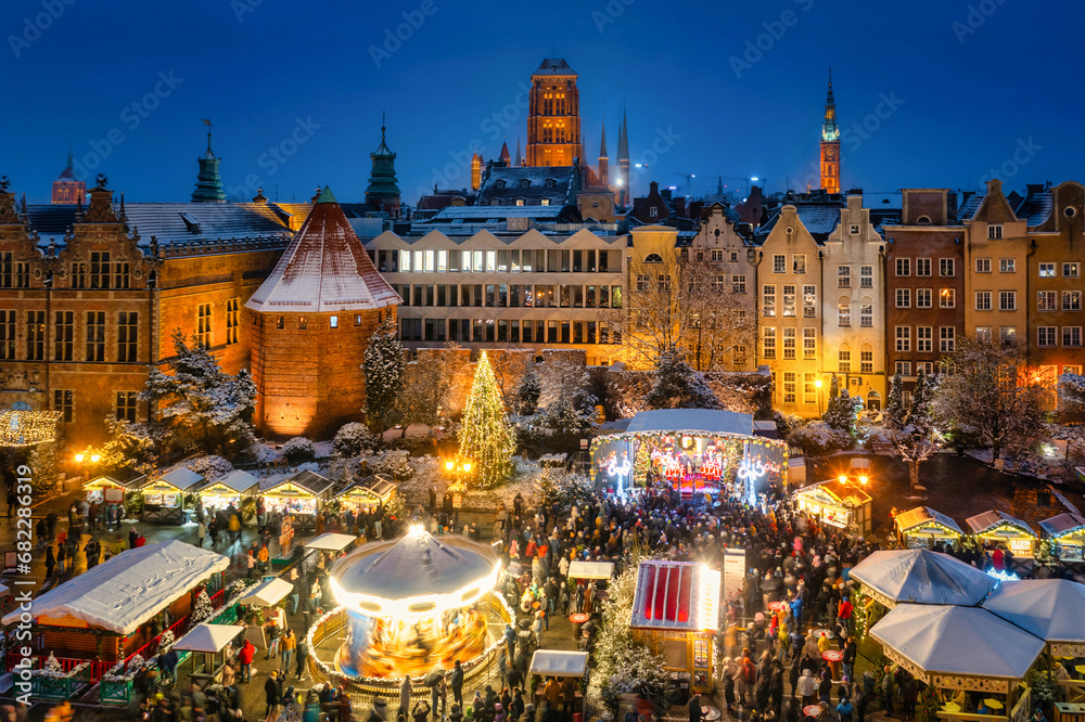 Beautifully lit Christmas fair in the Main City of Gdansk at dusk. Poland