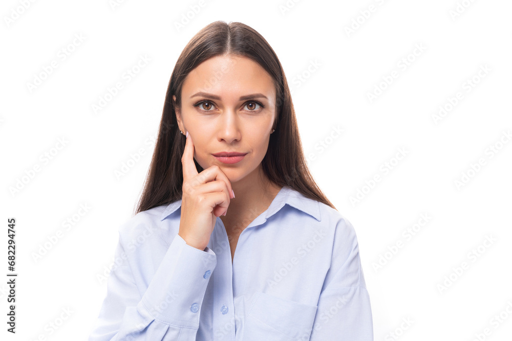 close-up of a young slender beautiful European brunette business woman with light makeup in a light blue shirt close-up of a young slender beautiful European brunette business woman with light makeup in a light blue shirt