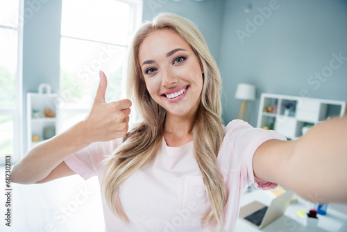 Photo of charming adorable girl entrepreneur realtor showing thumb up recommend comfort room house home