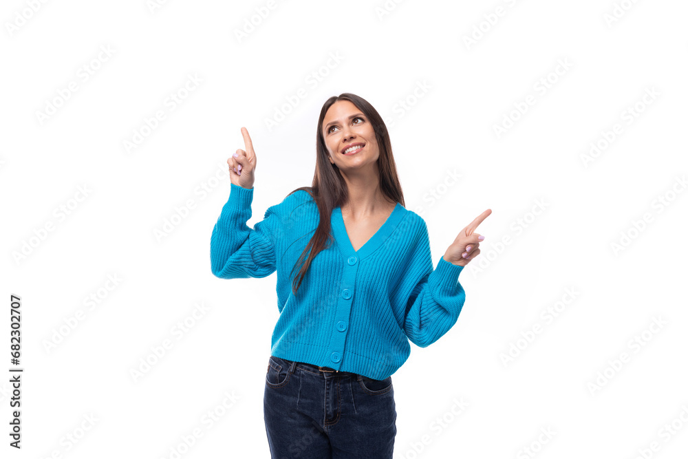 dreamy stylish young brunette lady dressed in blue casual button up cardigan on white background with copy space dreamy stylish young brunette lady dressed in blue casual button up cardigan on white background with copy space