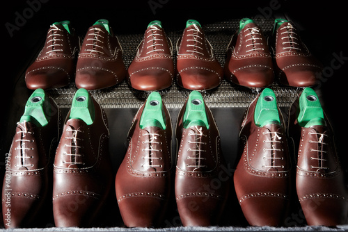 High Italian craftsmanship. Luxurious oxford model shoes, during a stage of processing, ready to receive the sole. 