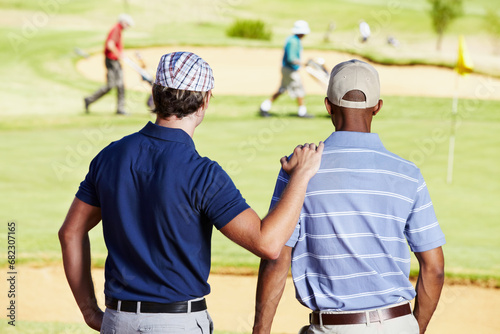 Fitness, golf and athletes in discussion on field writing notes for competition or tournament strategy. Sports, smile and professional happy male players talking for hobby on an outdoor course. © Kobus Tollig/peopleimages.com