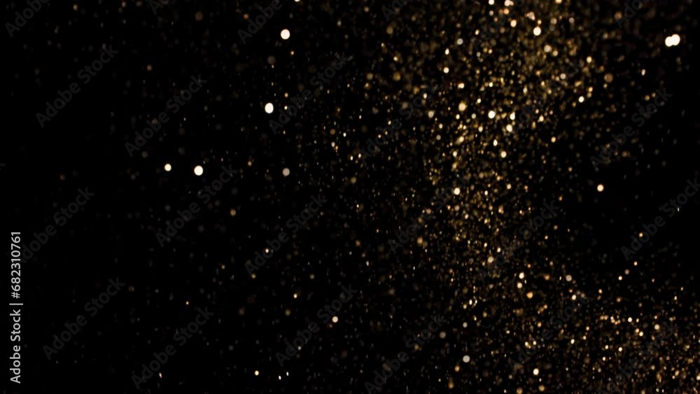 Super Slow Motion Shot of Festive Golden Glittering Background at 1000fps.