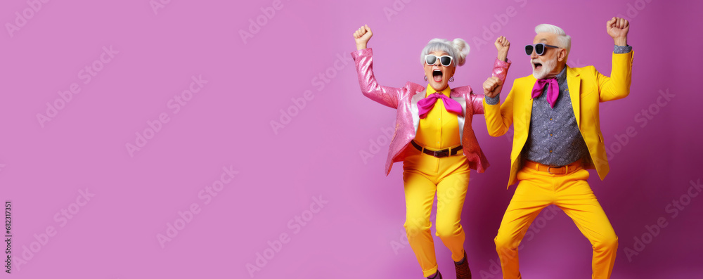 Cool retired hipsters, seniors party, carnival. Portrait of cheerful elderly gray-haired bearded grandparent wearing funny sunglasses and bright extravagant clothes on plain pink background - obrazy, fototapety, plakaty 