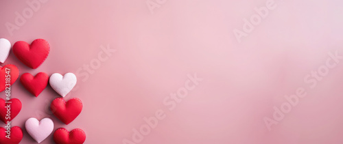 Valentine's Day background with red and white hearts on pink background. Banner. © Hryhor Denys