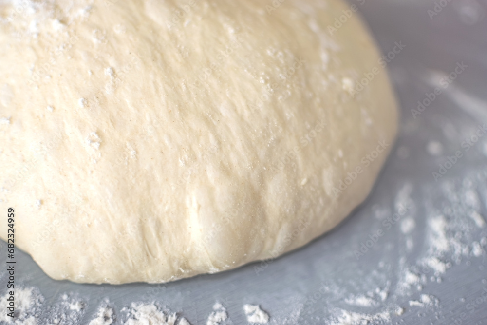 Close up view of Levitated and Puffed Dough with sprinkled flour Close up view of Levitated and Puffed Dough with sprinkled flour