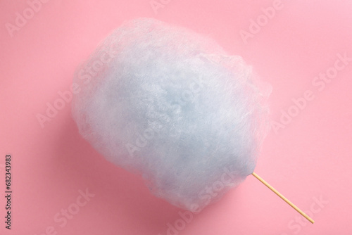 Sweet light blue cotton candy on pink background, top view