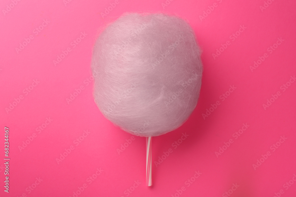 One sweet cotton candy on pink background, top view One sweet cotton candy on pink background, top view