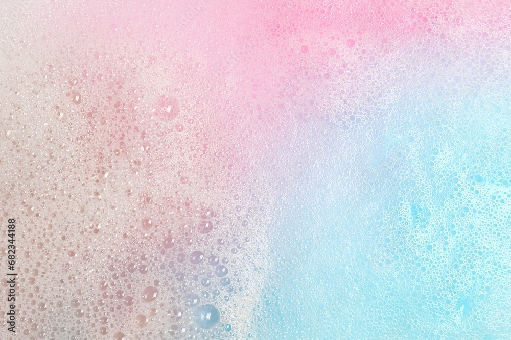 Fototapeta Colorful foam after dissolving bath bomb in water, closeup