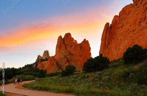 Tourists at trail of Garden of the Gods at sunrise. Garden of the Gods is a 1 341.3 acre public park located in Colorado Springs  Colorado  USA