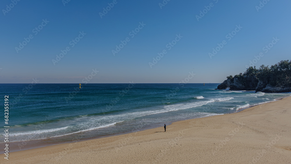 Beach scene with high waves on a windy day