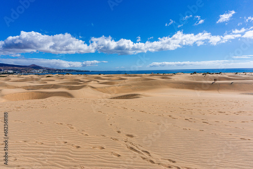 Fototapeta Naklejka Na Ścianę i Meble -  Gran Canaria Maspalomas. Shot from the Dunes with Sand and Sun and the Beach.