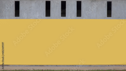 Yellow background on concrete wall