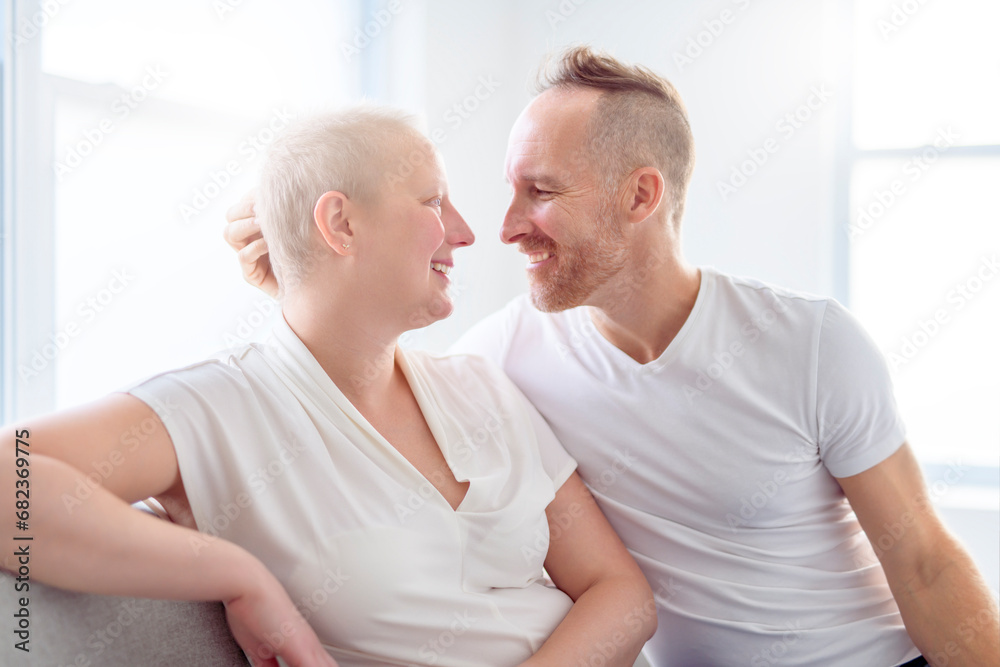 woman with Breast cancer in a bright room with her boyfriend woman with Breast cancer in a bright room with her boyfriend