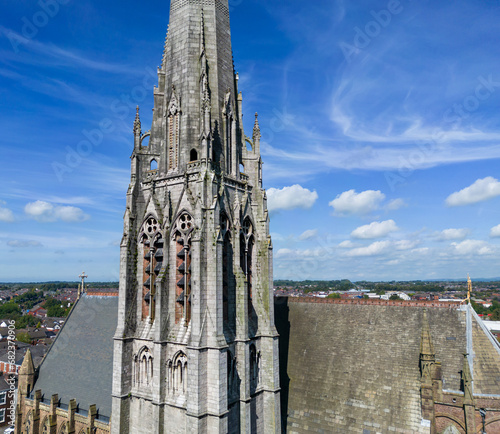 Preston, Lancashire, UK, September 03, 2023; Aerial Panoramic View of the 94m High Spire of the Shrine Church of St. Walburge's, Preston, England, UK photo