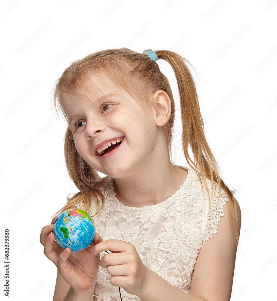 Blonde baby 6 years old, in a white dress shows a globe Blonde baby 6 years old, in a white dress shows a globe