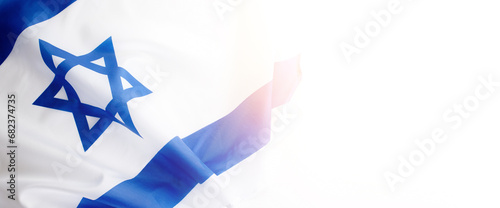 Banner with Official flag of Israel on a white background and empty space for text. Israeli flag for Jewish Holidays and independence day. photo