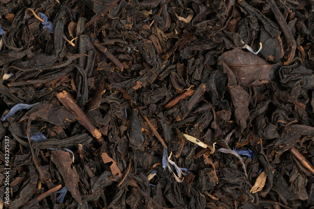 Pile leaf tea with various additives background, top view. Heap of dried tea texture Pile leaf tea with various additives background, top view. Heap of dried tea texture