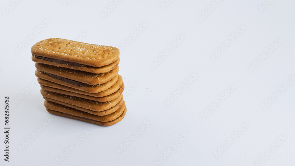 Stacked chocolate filled biscuits. Sweet cake isolated on white background.
Stacked chocolate filled biscuits. Sweet cake isolated on white background.
