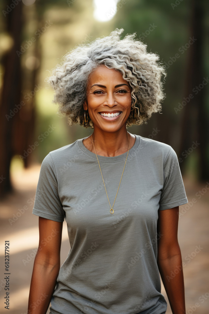 Portrait of a happy mature woman with curly grey hair in a forest setting perfect for lifestyle advertising and personal care branding Portrait of a happy mature woman with curly grey hair in a forest setting perfect for lifestyle advertising and personal care branding