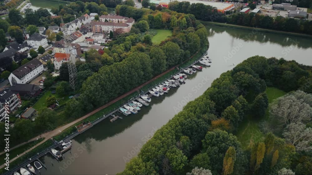 Drone aerial view of water canal with cargo ships, marina with boats at small town Datteln, Germany Drone aerial view of water canal with cargo ships, marina with boats at small town Datteln, Germany