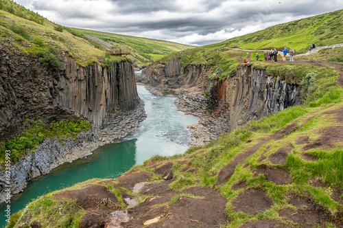 Jokla River cuts through the Studlagil canyon and passes by the hexagonal basalt columns caused by lava flows in Northeast Iceland, Jokuldalur Valley, Europe