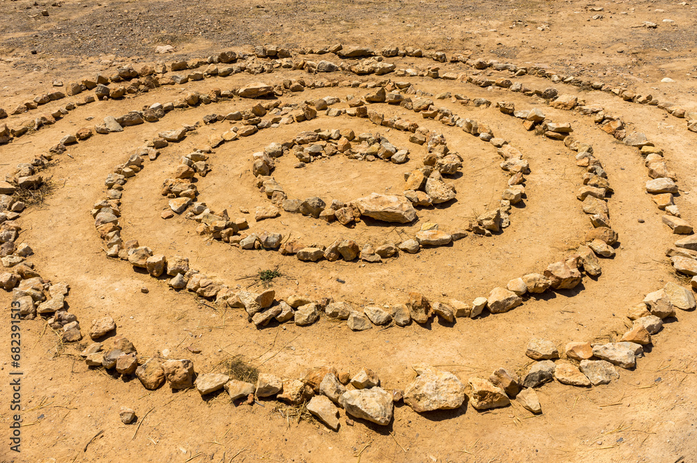Mysterious spiritual stone spiral in circular pattern found on clifftop on Mediterranean island of Ibiza