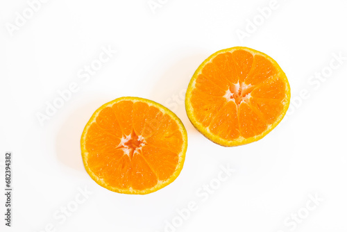 Sliced tangerine isolated on a white background. Top view.